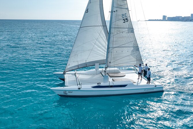 All-Inclusive Isla Mujeres Catamaran with Free Transportation - Onboard Oceanix Nauticos: mimosa, towels, and an open bar that actually helps