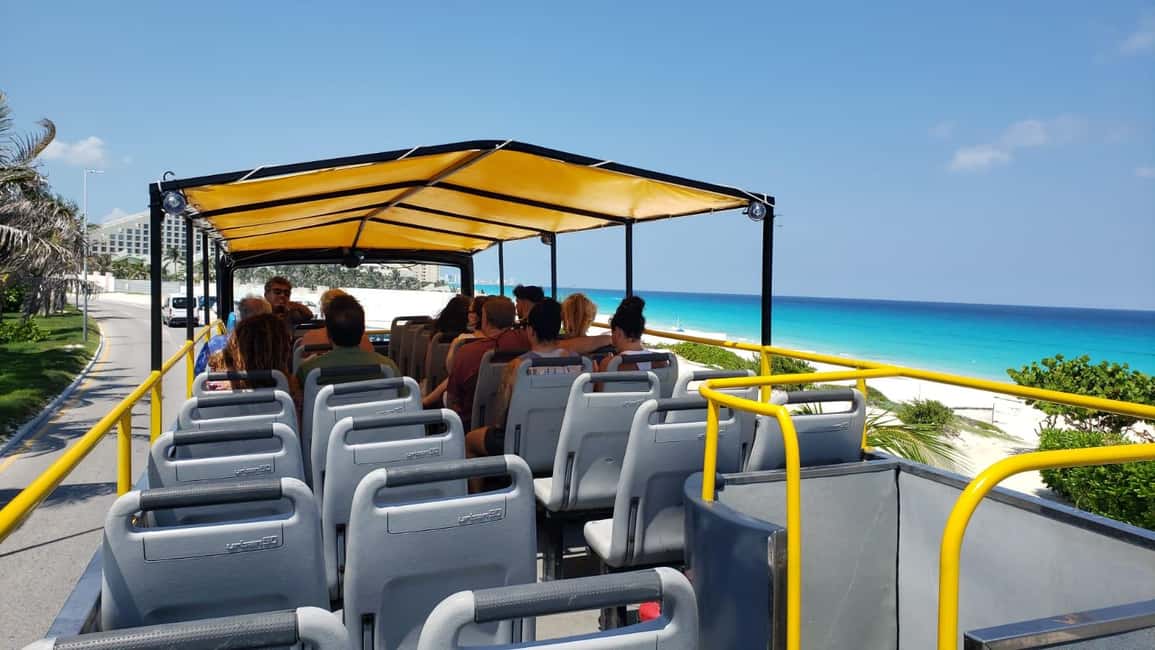 Cancun: Guided City Tour with Shopping by Double Decker Bus - Entrance fees, bottled water, beer: what’s actually included