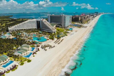Cancun Guided Sightseeing, Shopping and Tasting Tour - Getting Oriented Fast: Hotel Pickup and the Playa Delfines Photo Stop
