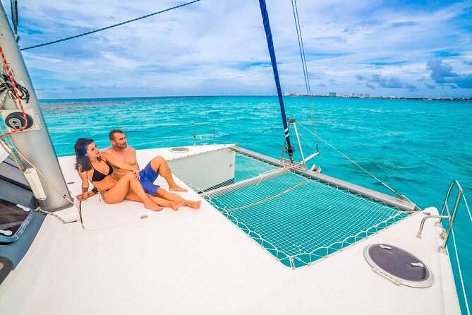 Catamaran to Isla Mujeres Snorkeling Tour with Open Bar and Lunch - Beach club time: relaxation, buffet lunch, and the outdoor-food reality