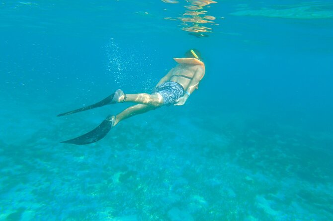 Dancer Cruise Isla Mujeres Snorkel Food and Drinks Included - The waterslide and trampoline swim stop: the best adrenaline window