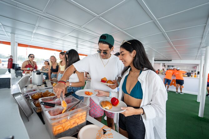 Dancer Cruise Isla Mujeres Snorkel Food and Drinks Included - The party crossing back: music, games, and open bar flow