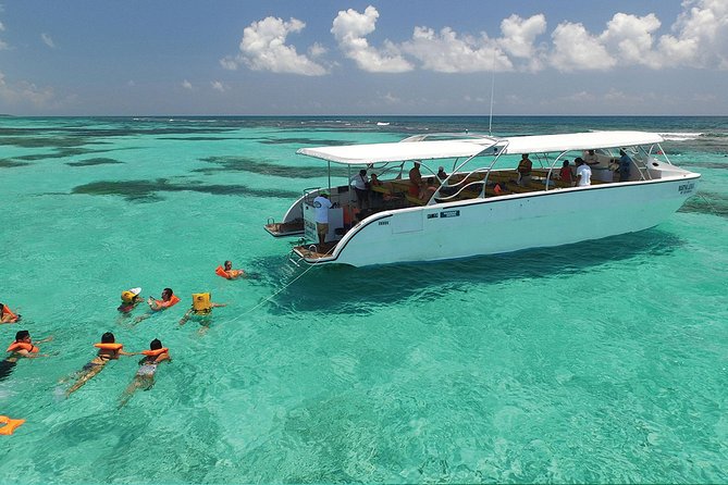 Isla Contoy and Isla Mujeres Tour with Snorkeling from Cancun - Isla Mujeres: beach time, shopping, and the party-deck return