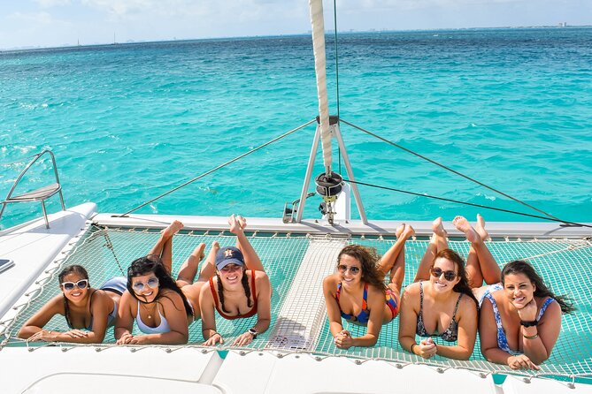 Isla Mujeres Catamaran Tour with Snorkel, Open bar and Transport - Playa Norte and Isla Mujeres time: beach beauty plus real-world crowds