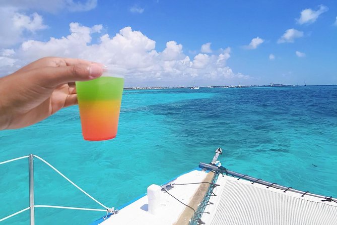 Isla Mujeres Premium Catamaran Tour with transportation from Playa del Carmen - The Catamaran Ride: Crew Energy, Music, and Comfort