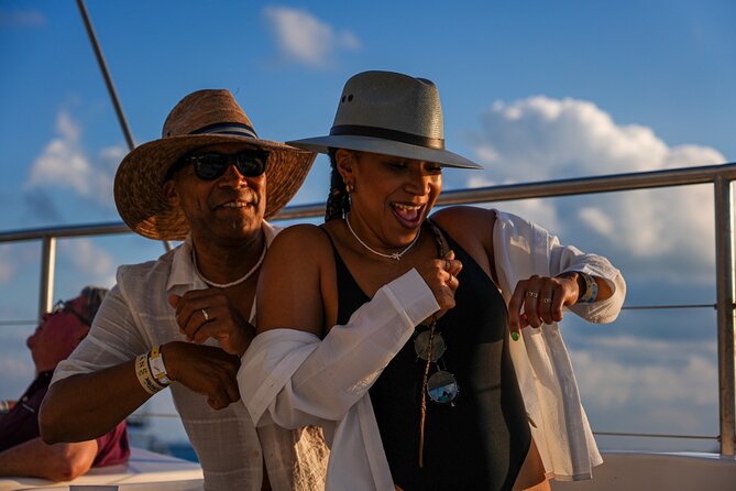 Isla Mujeres Sunset Cruise and Tour from Cancun - On Board: Drinks, Live Sax Music, and the Boat-Party Mood