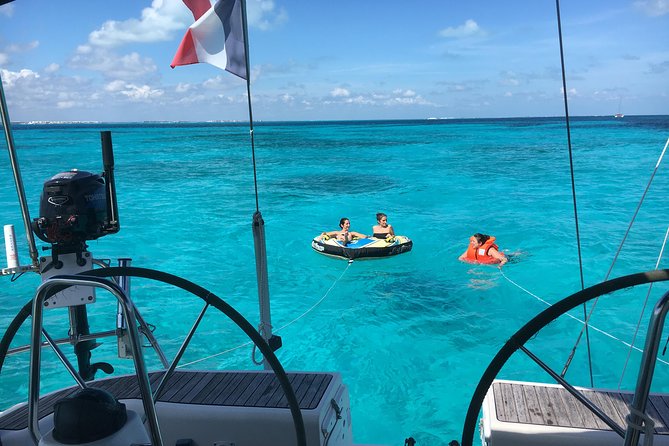 Private Customizable Sailing Tour in Cancun - Sailing Back Toward Cancun: Sunset Light and Cold Drinks